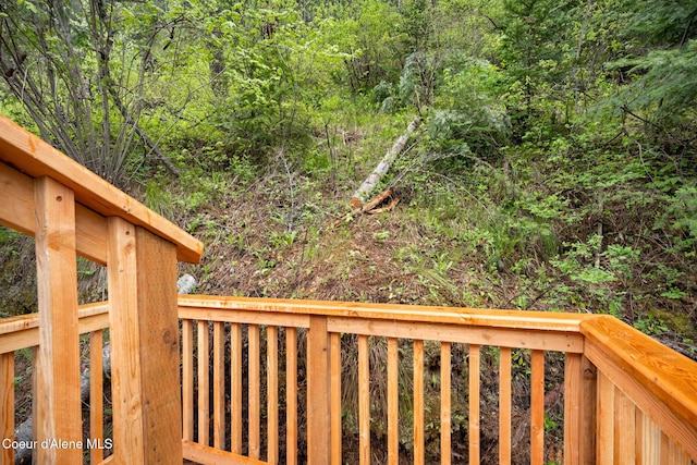 376 Second St, Mullan, ID 83846 - wooden terrace featuring a wooded view