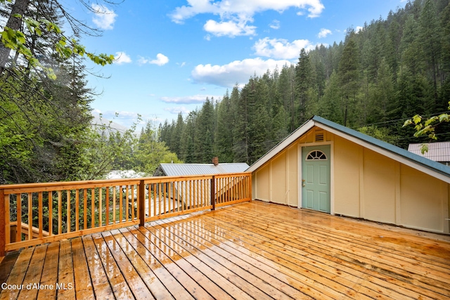 376 Second St, Mullan, ID 83846 - wooden deck featuring a view of trees