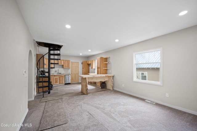 376 Second St, Mullan, ID 83846 - unfurnished living room featuring arched walkways, recessed lighting, baseboards, light carpet, and stairs