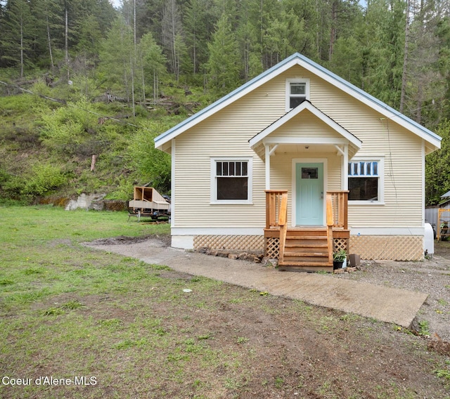 376 Second St, Mullan, ID 83846 - view of front facade with a forest view and a front yard