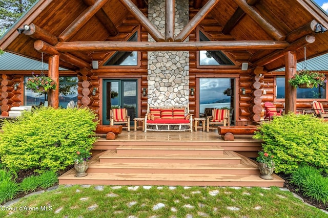 271 W Shore Ln, Sandpoint, ID 83864 - doorway to property with log exterior and french doors