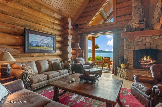 271 W Shore Ln, Sandpoint, ID 83864 - living area featuring wood ceiling, wood finished floors, a fireplace, high vaulted ceiling, and log walls