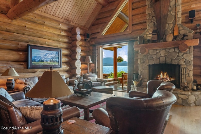 271 W Shore Ln, Sandpoint, ID 83864 - living area with wood-type flooring, wood ceiling with exposed beams, log walls, a fireplace, and high vaulted ceiling
