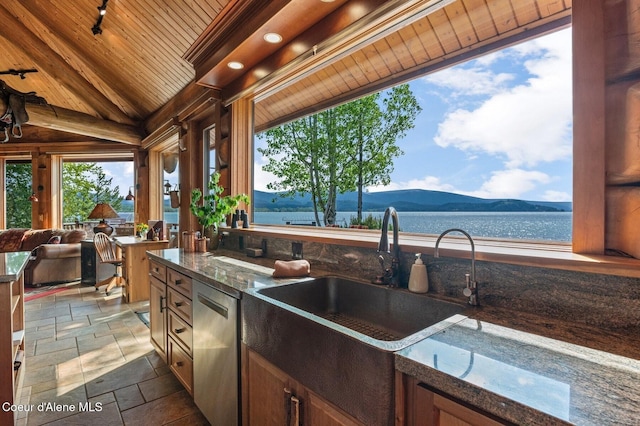 271 W Shore Ln, Sandpoint, ID 83864 - view of patio / terrace featuring exterior kitchen, a water and mountain view, and a sink
