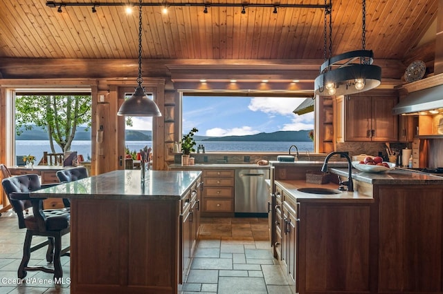 271 W Shore Ln, Sandpoint, ID 83864 - kitchen with stainless steel dishwasher, rail lighting, wood ceiling, a sink, and a kitchen island