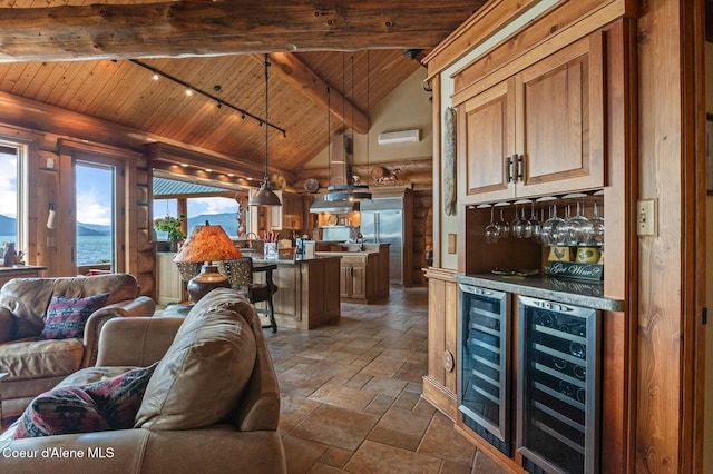 271 W Shore Ln, Sandpoint, ID 83864 - living room with wood ceiling with exposed beams, wine cooler, a dry bar, track lighting, and stone tile floors