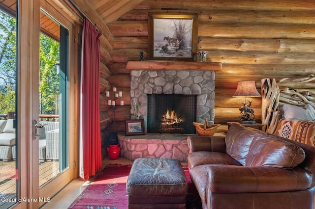 271 W Shore Ln, Sandpoint, ID 83864 - living room featuring log walls, a fireplace, and vaulted ceiling