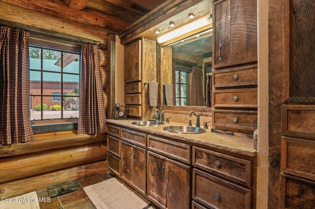 271 W Shore Ln, Sandpoint, ID 83864 - bathroom featuring vanity, wood ceiling, and stone finish flooring