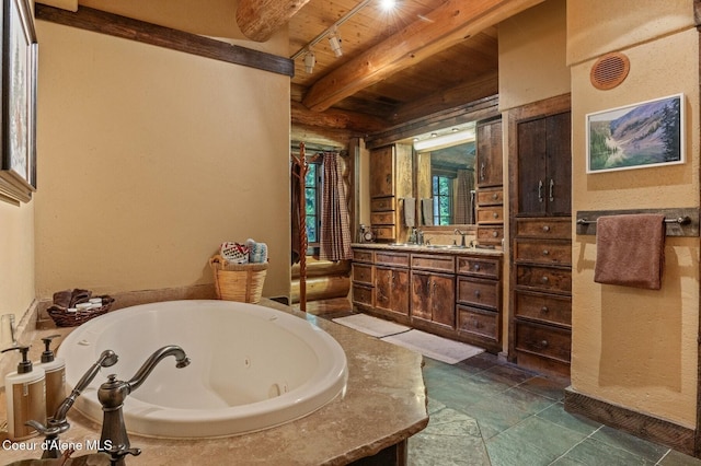 271 W Shore Ln, Sandpoint, ID 83864 - full bathroom with wood ceiling with exposed beams, a tub with jets, and vanity