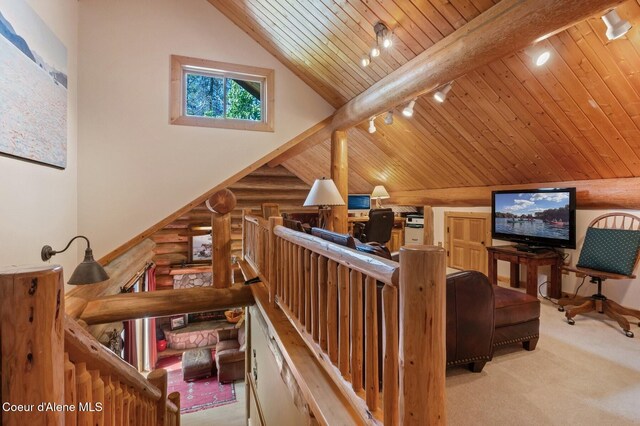 271 W Shore Ln, Sandpoint, ID 83864 - living room with track lighting, wood ceiling, carpet, vaulted ceiling, and log walls