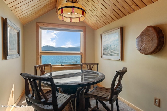 271 W Shore Ln, Sandpoint, ID 83864 - dining room featuring baseboards, wood ceiling, carpet, and vaulted ceiling