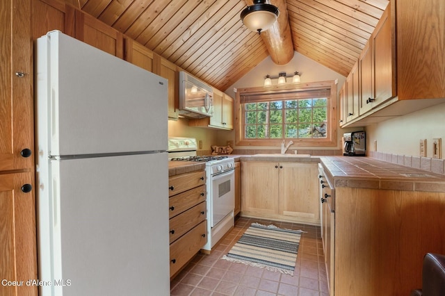 271 W Shore Ln, Sandpoint, ID 83864 - kitchen featuring white appliances, tile counters, light tile patterned flooring, a sink, and wooden ceiling