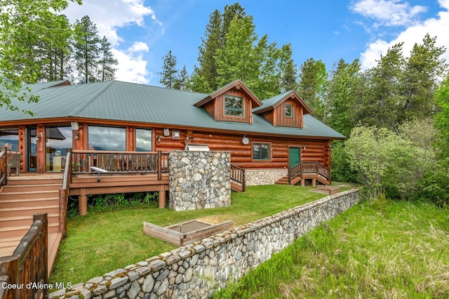 271 W Shore Ln, Sandpoint, ID 83864 - rear view of property featuring log exterior, a lawn, stairway, and a deck