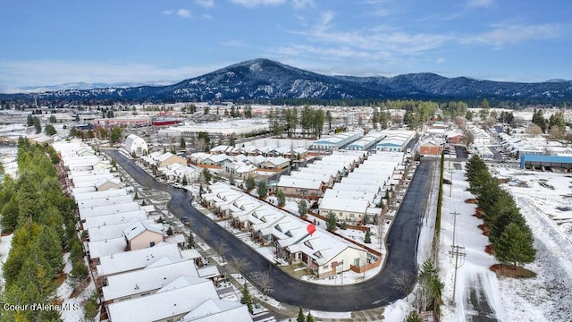 4362 N Meadow Ranch Ave, Coeur Dalene, ID 83815 - snowy aerial view with a mountain view and a residential view