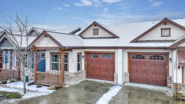 4362 N Meadow Ranch Ave, Coeur Dalene, ID 83815 - view of front of home featuring stone siding and a garage