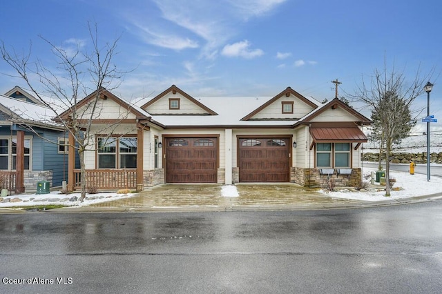 4362 N Meadow Ranch Ave, Coeur Dalene, ID 83815 - craftsman house featuring stone siding, a garage, and concrete driveway