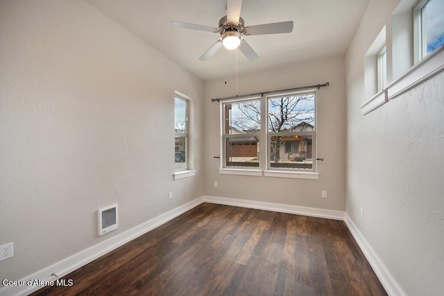 4362 N Meadow Ranch Ave, Coeur Dalene, ID 83815 - unfurnished room featuring dark wood finished floors, baseboards, and a ceiling fan