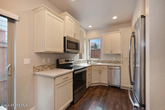 4362 N Meadow Ranch Ave, Coeur Dalene, ID 83815 - kitchen featuring appliances with stainless steel finishes, a sink, dark wood-style floors, light countertops, and recessed lighting