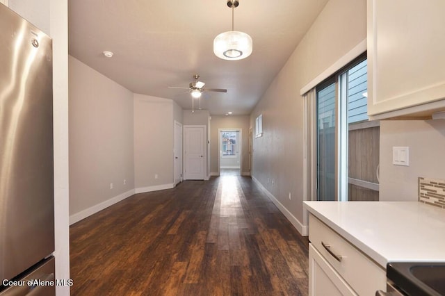 4362 N Meadow Ranch Ave, Coeur Dalene, ID 83815 - foyer with dark wood finished floors, ceiling fan, and baseboards