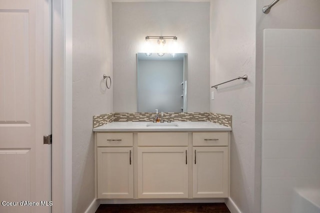 4362 N Meadow Ranch Ave, Coeur Dalene, ID 83815 - bathroom featuring vanity, tasteful backsplash, a shower, and baseboards