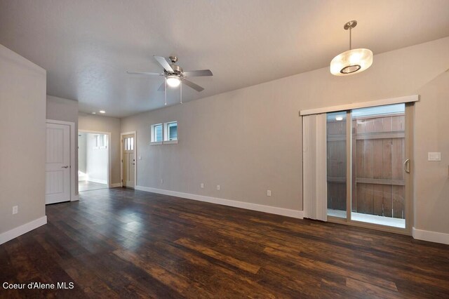 4362 N Meadow Ranch Ave, Coeur Dalene, ID 83815 - empty room featuring baseboards, dark wood-style floors, and a ceiling fan