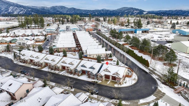 4362 N Meadow Ranch Ave, Coeur Dalene, ID 83815 - snowy aerial view with a mountain view and a residential view
