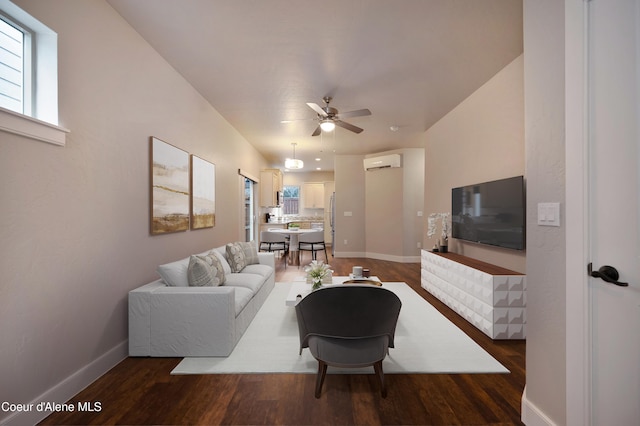 4362 N Meadow Ranch Ave, Coeur Dalene, ID 83815 - living area featuring a wall mounted AC, a ceiling fan, dark wood finished floors, and baseboards