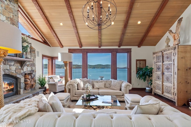 living area featuring wood ceiling, wood finished floors, beam ceiling, a water view, and a chandelier