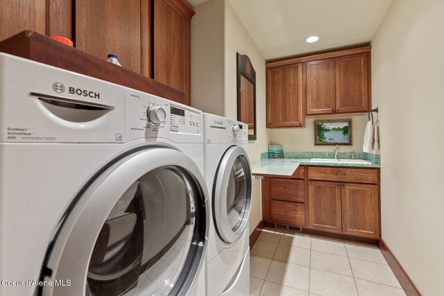washroom featuring independent washer and dryer, cabinet space, light tile patterned flooring, and recessed lighting