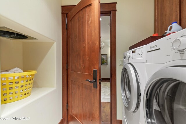 clothes washing area featuring independent washer and dryer