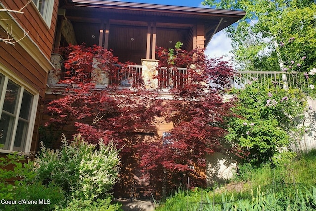 view of side of property with a porch