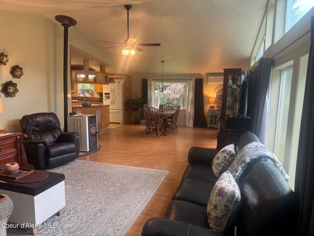 295 A St, Sandpoint, ID 83864 - living room featuring light wood-style floors, a ceiling fan, and lofted ceiling