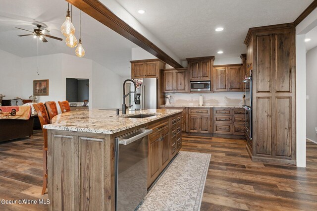 1341 Merideth Rd, Plummer, ID 83851 - kitchen with appliances with stainless steel finishes, ceiling fan, open floor plan, a sink, and dark wood finished floors