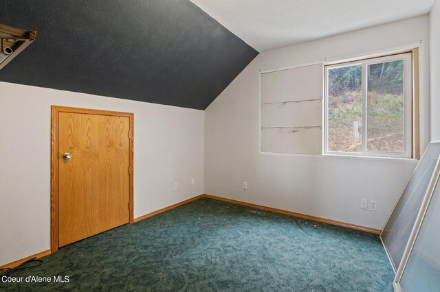 1341 Merideth Rd, Plummer, ID 83851 - additional living space featuring vaulted ceiling, dark colored carpet, and baseboards