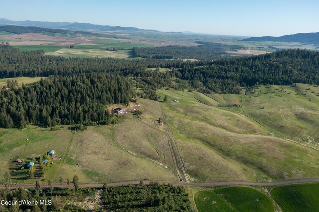 1341 Merideth Rd, Plummer, ID 83851 - aerial view of property and surrounding area featuring a mountainous background and a heavily wooded area