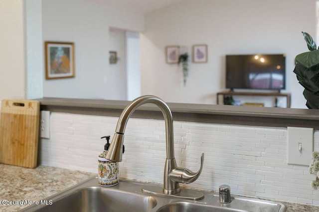 detailed view of a sink and backsplash