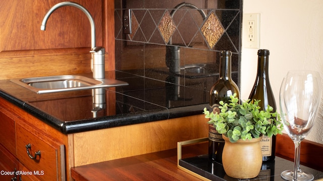 3361 Bottle Bay Rd, Sagle, ID 83860 - kitchen view of a sink, brown cabinets, and dark countertops