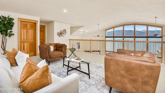 3361 Bottle Bay Rd, Sagle, ID 83860 - living area with a ceiling fan, vaulted ceiling, carpet floors, a mountain view, and recessed lighting