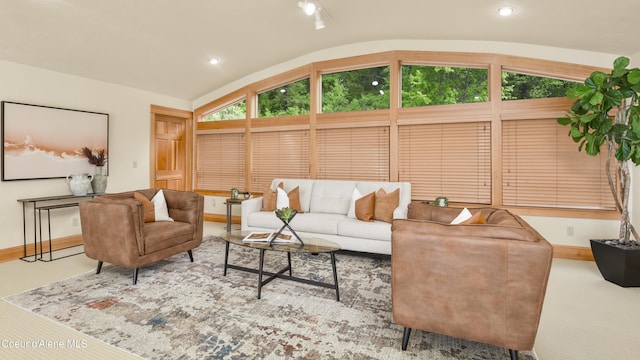 3361 Bottle Bay Rd, Sagle, ID 83860 - carpeted living area with lofted ceiling, baseboards, and recessed lighting