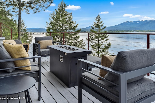 3361 Bottle Bay Rd, Sagle, ID 83860 - wooden deck featuring a mountain view and an outdoor fire pit