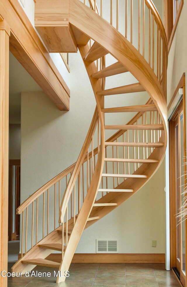 3361 Bottle Bay Rd, Sagle, ID 83860 - stairway featuring a towering ceiling and tile patterned floors