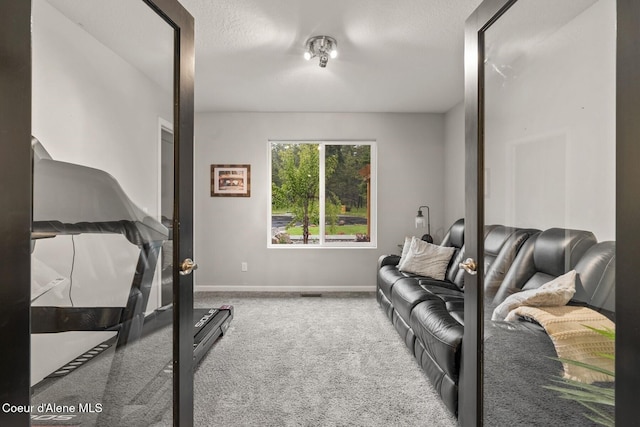 990 Goldfinch Ln, Spirit Lake, ID 83869 - carpeted living room with baseboards