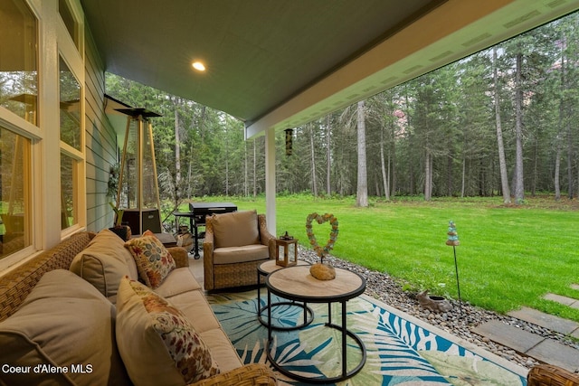 990 Goldfinch Ln, Spirit Lake, ID 83869 - view of patio / terrace with outdoor lounge area and a wooded view
