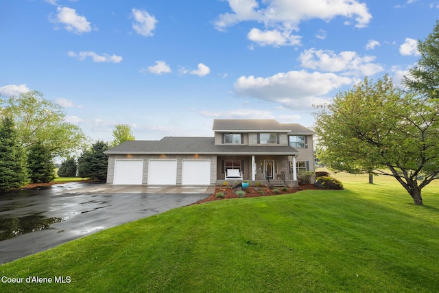 22385 N Ranch View Dr, Rathdrum, ID 83858 - traditional-style house featuring asphalt driveway, a porch, a garage, and a front yard