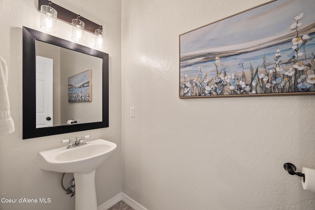 22385 N Ranch View Dr, Rathdrum, ID 83858 - bathroom featuring baseboards and a sink