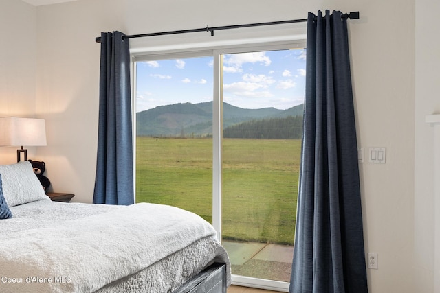 22385 N Ranch View Dr, Rathdrum, ID 83858 - bedroom with access to exterior and a mountain view