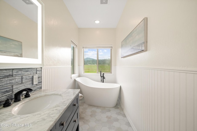 22385 N Ranch View Dr, Rathdrum, ID 83858 - full bath featuring wainscoting, a freestanding bath, vanity, and tile patterned floors