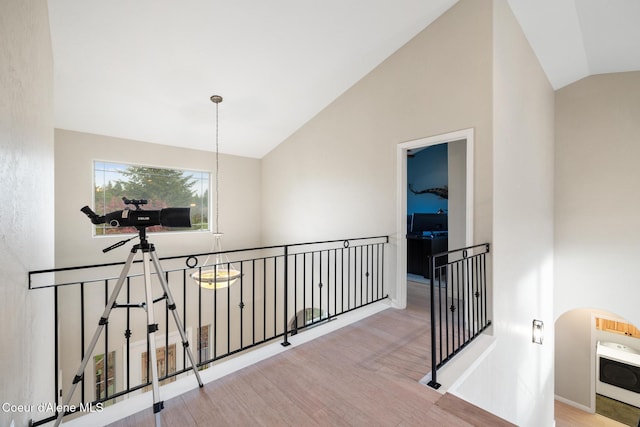 22385 N Ranch View Dr, Rathdrum, ID 83858 - hallway with lofted ceiling, wood finished floors, an upstairs landing, and baseboards