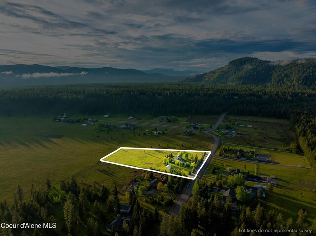 22385 N Ranch View Dr, Rathdrum, ID 83858 - view of rural area featuring a mountainous background, property boundaries highlighted, and a heavily wooded area