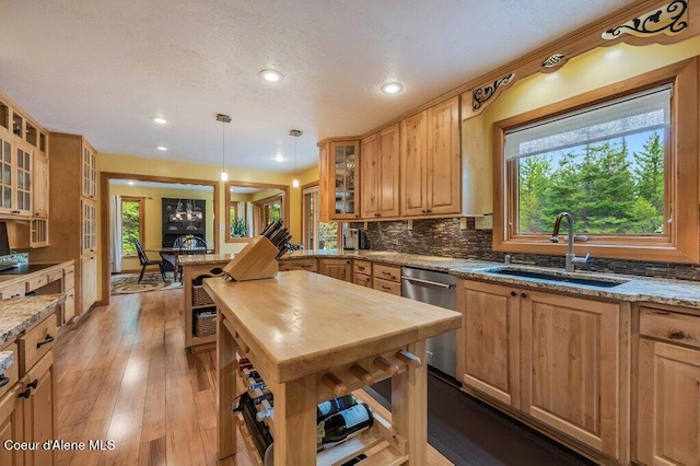 521 Shady Pines Loop, Priest Lake, ID 83856 - kitchen with a sink, dishwasher, healthy amount of natural light, backsplash, and recessed lighting